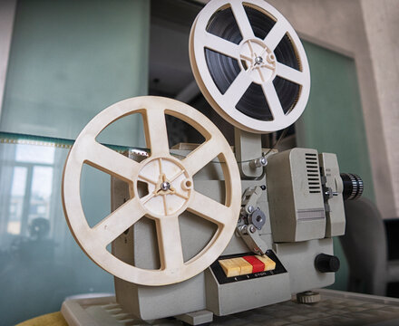 A vintage 8mm movie projector. close up