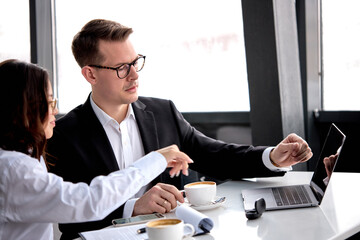 Serious Businessman Use Laptop While Doing Business Project
