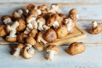 .Fresh shiitake mushrooms on the wooden kitchen table