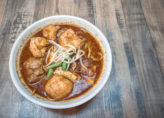 A serving of delicious curry noodles, one of Malaysia famous dishes. Selective focus points.