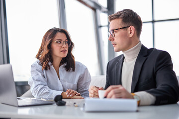 Fototapeta premium Pleasant manager sit having nice talk with male businessman