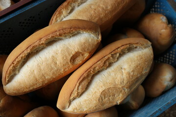 Plastic box full of freshly baked bread.