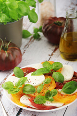 A plate with Italian salad caprese