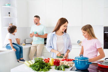 Photo portrait of little son and daughter cooking spending free time together with their parents