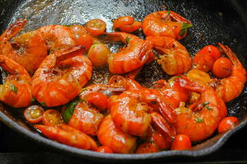 Shrimp buttered in a cast iron skillet