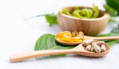 Alternative medicine herbal organic capsule with vitamin E omega 3 fish oil, mineral, drug with herbs leaf natural supplements for healthy good life.