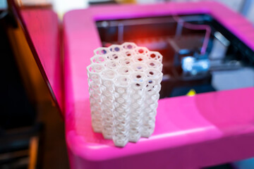 3D printer or additive manufacturing and robotic automation technology.