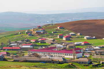 Naklejka premium School building in a small mountain village