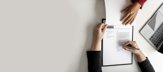 The job applicant is checking the resume with the Human Resources Department before taking the job...