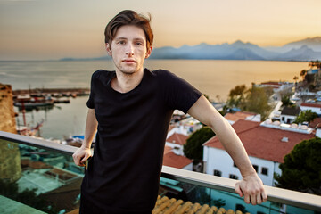 European man 25 years old on observation deck in Antalya.