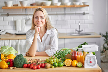 Woman and table with healthy food selection. Detox and clean diet. Foods high in vitamins, minerals and antioxidants