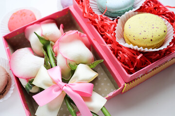 sweet dessert. macarons, gift box and a bouquet of flowers. 
