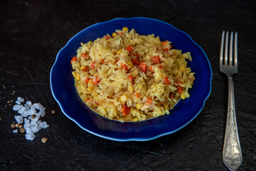 Risotto with chicken and vegetables. A plate of rice with vegetables. Selective focus.