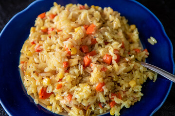 Risotto with chicken and vegetables. A plate of rice with vegetables. Selective focus.