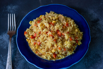 Risotto with chicken and vegetables. A plate of rice with vegetables. Selective focus.