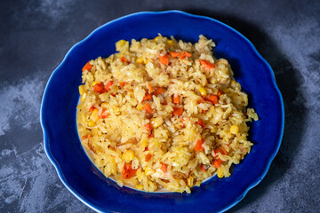Risotto with chicken and vegetables. A plate of rice with vegetables. Selective focus.