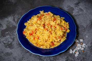 Risotto with chicken and vegetables. A plate of rice with vegetables. Selective focus.