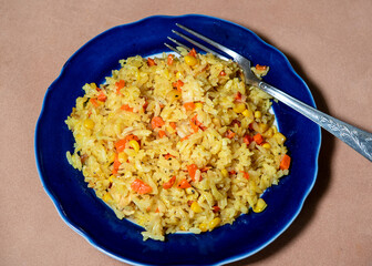 Risotto with chicken and vegetables. A plate of rice with vegetables. Selective focus.