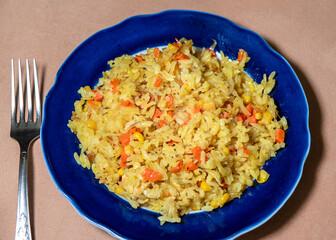 Risotto with chicken and vegetables. A plate of rice with vegetables. Selective focus.