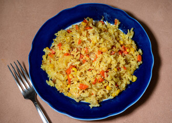 Risotto with chicken and vegetables. A plate of rice with vegetables. Selective focus.