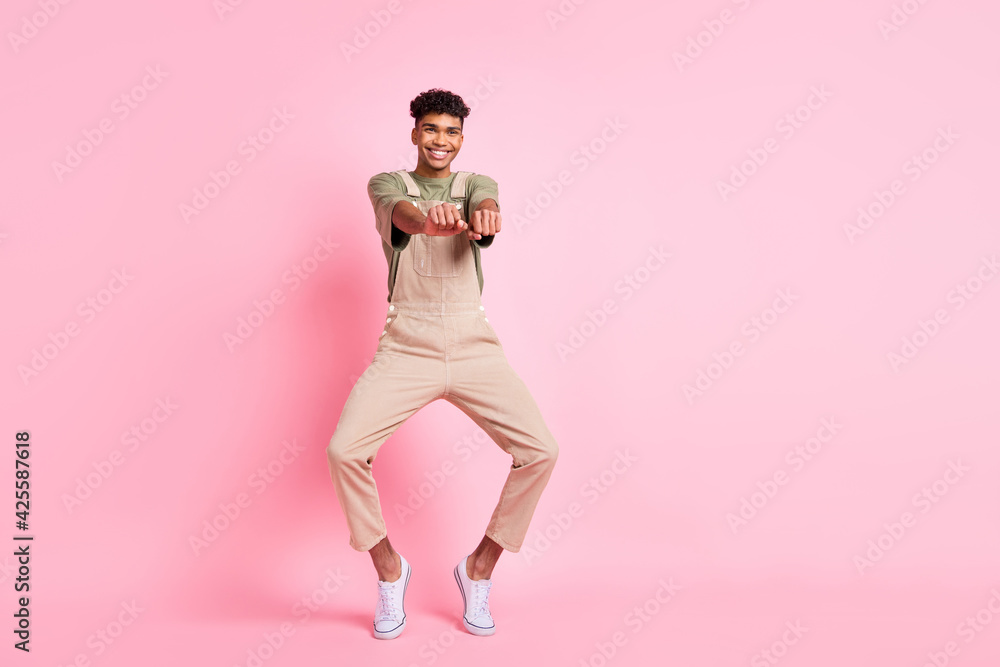 Sticker Photo of crazy positive guy cowboy dance have fun wear beige overall footwear isolated pink color background