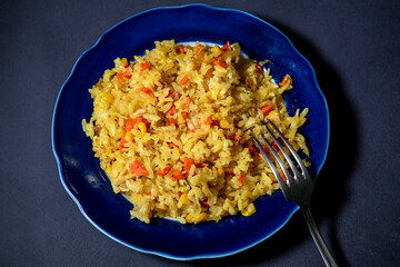 Risotto with chicken and vegetables. A plate of rice with vegetables. Selective focus.