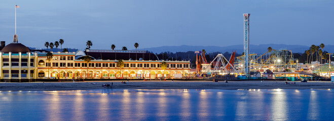 Santa Cruz, California - April 3, 2021: Santa Cruz Beach Boardwalk Amusement Park during the blue...