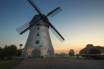 Obraz premium Traditional Old dutch windmill in Latvia. Sunrise to Araisi windmill in Vidzeme.