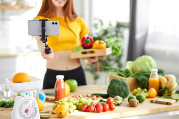 Social media and content creator occupation new job in future. food blogger holding fresh food. focus on mobile phone