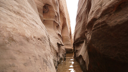 Zebra, Peek-A-Boo and Spooky Slot Canyons exploration in dry arid landscapes near Escalante Town, Utah, USA.