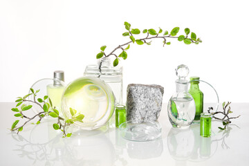 Natural Green laboratory. Abstract floral arrangement. Grey granite podium with product in...