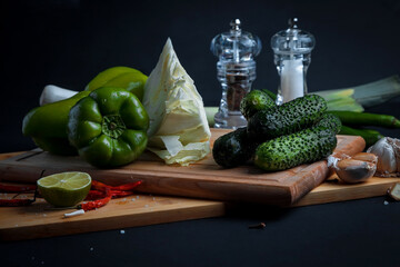 Dorado fish is cooked in a black grill pan. Seafood and vegetables. Seasonings and spices.