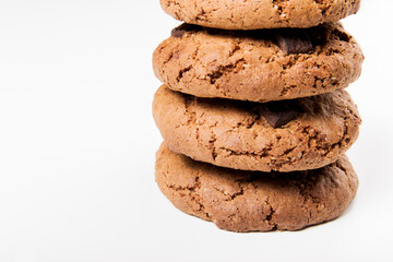 Fototapeta na wymiar Chocolate chip cookies with chocolate pieces. White background. Close-up view