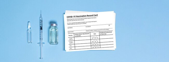 Coronavirus vaccination record card. Covid19 vaccine vial and syringe, Coronavirus immunization...