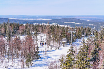 Beautiful winter mountain landscape of the Urals region, Russia. Chairlift on the Mount Belaya.