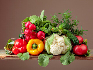 Various fresh raw vegetables, frontal view.