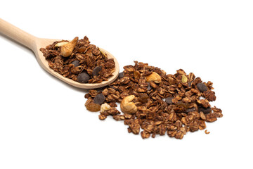 Chocolate granola cereal with nuts in a wooden spoon.