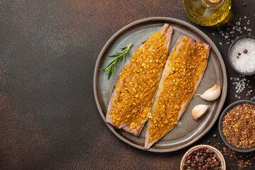 Marinated mackerel fish on ceramic plate and spices for cooking