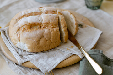 Freshly baked white bread on the table stylish setting