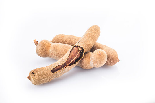 Tamarind (Tamarindus indica) fruit isolated on white background