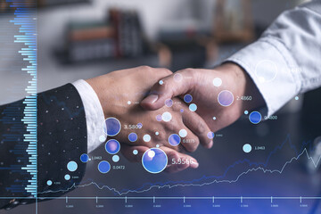 A handshake as a symbol of successful transaction on brokerage services at international investment bank. Capital market, stock trading. Financial hologram chart. Women in business.