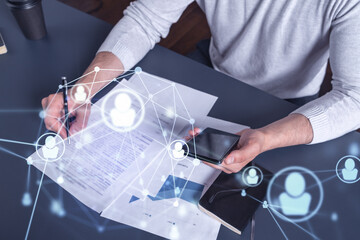 A potential employee signing the contract to boost his career and gain new opportunities in personal growth. Concept of success. Checking the detail of the deal at smartphone. Social media icons