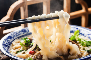 A bowl of noodles with braised beef