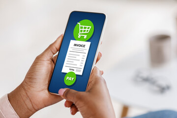 Black woman using mobile smartphone with payment system screen