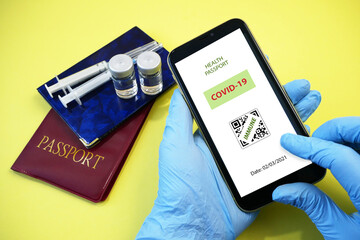 Vaccination passport on a mobile phone allowing travel in hand. Vaccination against the coronavirus Covid 19.Imunity or Health passport