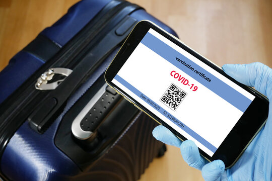 Vaccination passport on a mobile phone allowing travel in hand. Vaccination against the coronavirus Covid 19.Imunity or Health passport