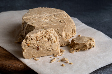 Halva sunflower - sweet dessert on a dark background. Selective focus.