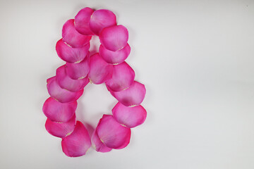 Number 8 is lined with rose petals. March 8. Number eight.