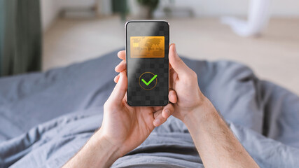 Unrecognizable Man Using Smartphone Payment Screen At Home