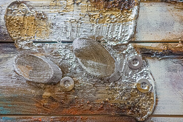 Background with paint and buttons on wooden planks